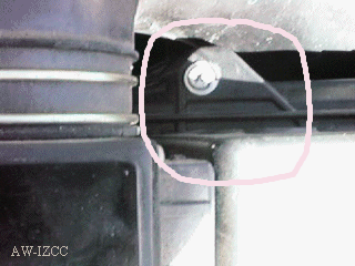 one of two screws holding top of airbox