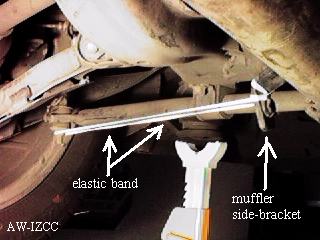 elastic band holding the muffler out of the way